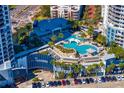 Aerial shot of pool and amenities at Towers; palm trees surround the clubhouse at 449 S 12Th St # 1705, Tampa, FL 33602