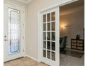 Welcoming foyer featuring a decorative glass door and an adjacent office at 5006 Ivory Stone Dr, Wimauma, FL 33598