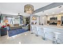 Bright kitchen with an open layout, stylish island, and seamless connection to the living area at 6902 El Centro Ct, Tampa, FL 33634