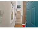 Bright entryway with a staircase, a light fixture, and an open door at 732 Coral Reef Dr # 732, Tampa, FL 33602