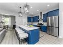 Beautiful kitchen with a large island, stainless steel appliances, and barstool seating at 901 Eagle Ln, Apollo Beach, FL 33572