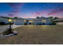 Charming single-story home featuring a well-manicured lawn and inviting curb appeal at 1508 W Del Webb Blvd, Sun City Center, FL 33573