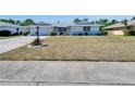 Charming single-story home with a well-maintained front yard and attached garage at 1508 W Del Webb Blvd, Sun City Center, FL 33573