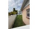 View of the fenced backyard featuring lush greenery and serene privacy for relaxation and outdoor enjoyment at 205 S Shore Crest Dr, Tampa, FL 33609