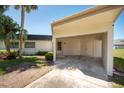 Charming single-story home featuring a carport and mature landscaping at 2610 Forest Run Ct, Clearwater, FL 33761