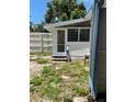 An enclosed porch can be accessed from the backyard at 38030 Howard Ave, Dade City, FL 33525