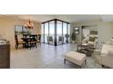 Bright and airy living room with water views, neutral tile, and dining room area at 5729 Puerta Del Sol Boulevard South # 486, St Petersburg, FL 33715
