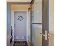 Charming condo entrance with a welcoming wreath and a glimpse into the foyer at 5915 Sea Ranch Dr # 403, Hudson, FL 34667