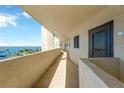 Exterior walkway with unit door and ocean view at 5915 Sea Ranch Dr # 403, Hudson, FL 34667