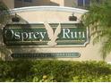 Osprey Run community sign with lush landscaping and a neighborhood feel at 6002 Osprey Lake Cir, Riverview, FL 33578