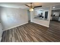 Open living room showcasing wood-look flooring and open access to the kitchen at 645 38Th S Ave, St Petersburg, FL 33705