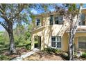Charming two-story home featuring a covered entry and manicured landscaping, set against a sunny backdrop at 10906 Johanna Ave, Riverview, FL 33578