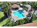 A refreshing community pool surrounded by lush landscaping and comfortable lounging areas at 10906 Johanna Ave, Riverview, FL 33578