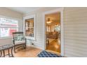 Cozy sunroom with patterned tile floor, wicker furniture, and a view of the living room at 129 18Th N Ave, St Petersburg, FL 33704