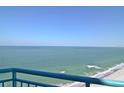 Relaxing balcony view showcasing calm ocean waters under a bright sky, promising serene coastal living at 1520 Gulf Blvd # Ph2, Clearwater Beach, FL 33767