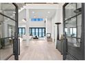 Bright, open living space with modern finishes and floor-to-ceiling windows offering breathtaking water views at 1906 Carolina Ne Ave, St Petersburg, FL 33703