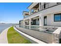 A resort-style pool provides the perfect outdoor oasis in this luxurious waterfront property at 1906 Carolina Ne Ave, St Petersburg, FL 33703