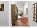 Elegant hallway featuring hardwood floors, tray ceilings, and decorative furnishings at 20173 Umbria Hill Dr, Tampa, FL 33647