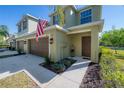 Well-kept home exterior with an attached two-car garage, neat landscaping, and a neatly paved driveway at 20319 Starfinder Way, Tampa, FL 33647