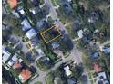 Aerial view of a home site highlighting its position within a residential neighborhood and tree coverage at 458 W Davis Blvd, Tampa, FL 33606