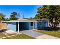 Cozy single-story home with a covered carport and freshly painted exterior at 4716 Town N Country Blvd, Tampa, FL 33615