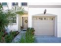 Close up of front entrance and garage with fresh landscaping and neutral paint at 592 Black Lion Ne Dr, St Petersburg, FL 33716