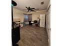 Spacious bedroom with wood floors, neutral walls, and ample natural light at 7530 Roy Ct, New Port Richey, FL 34654
