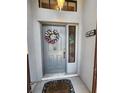 Welcoming front door featuring a seasonal wreath and motivational signage at 7530 Roy Ct, New Port Richey, FL 34654