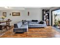Cozy living room featuring stylish furniture, wood floors, and a bright window showcasing modern interior design at 9209 Seminole Blvd # 145, Seminole, FL 33772
