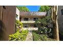Apartment building exterior showcases a community with green spaces and easy access to units at 11711 Raintree Village Blvd # C, Temple Terrace, FL 33617