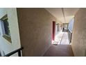 Exterior hallway with direct access to the unit, and secure doors at 11711 Raintree Village Blvd # C, Temple Terrace, FL 33617