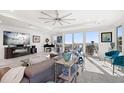 Bright living room with tile floors, grand windows with beach view, and a modern interior at 15 Avalon St # 303, Clearwater Beach, FL 33767