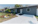 Charming home features new walkway, landscaping, and freshly painted exterior at 1605 Crown St, Clearwater, FL 33755