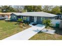 Charming home features new walkway, landscaping, and freshly painted exterior at 1605 Crown St, Clearwater, FL 33755