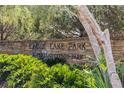 Stone sign with 'EAGLE LAKE PARK' text surrounded by green bushes and trees at 1881 Oak Park N Dr, Clearwater, FL 33764