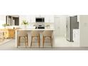 Contemporary kitchen featuring white cabinets, stainless appliances, island with seating, and pendant lighting at 3704 Forest Path Dr, Plant City, FL 33565