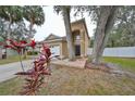 Charming home featuring an attached two-car garage, mature trees and well maintained landscaping at 6930 Summer Harbor Ln, Riverview, FL 33578
