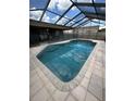 Screened-in pool features ample natural light and easy access to the home interior at 727 Flamingo Dr, Apollo Beach, FL 33572