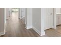 Hallway with elegant baseboards and luxury vinyl flooring at 8521 Dove Bog Ter, Parrish, FL 34219
