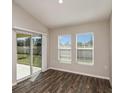 Bright sunroom with sliding glass doors to the patio and large windows that provide ample natural light at 14777 Summer Branch Dr, Lithia, FL 33547