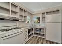 Efficient kitchen with essential appliances, abundant cabinet space, and bright, natural light at 1608 Thrush Dr, Zephyrhills, FL 33540
