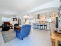 Open-concept living room showcasing seamless flow to the modern kitchen and dining area at 2593 W Vina Del Mar Blvd, St Pete Beach, FL 33706