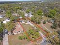 Aerial view of the property including the house, driveway, surrounding greenery, and a defined property line at 4020 Amber Rd, Valrico, FL 33594
