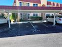 Carport parking with assigned spots in front of the condo building at 205 Dogwood Cir # 205, Seminole, FL 33777