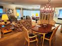 Open living and dining room with chandelier and furnishings at 205 Dogwood Cir # 205, Seminole, FL 33777