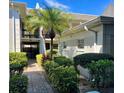 Exterior view of well-maintained building with landscaping and palm trees at 5221 Bayshore Blvd # 29, Tampa, FL 33611