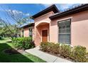 Inviting home exterior with a well-manicured lawn and lush landscaping surrounding the property at 178 Shell Falls Dr, Apollo Beach, FL 33572