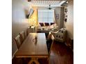 Cozy dining and living area boasts wood floors and ample lighting at 2320 W Azeele St # 317, Tampa, FL 33609