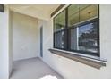 Inviting front porch featuring a window, a neutral color scheme, and a modern design at 2618 15Th N Ave, St Petersburg, FL 33713