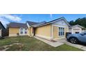 Charming single-Gathering home with well-maintained lawn, neutral color scheme, and a detached one car garage at 2108 Ridgemore Dr, Valrico, FL 33594
